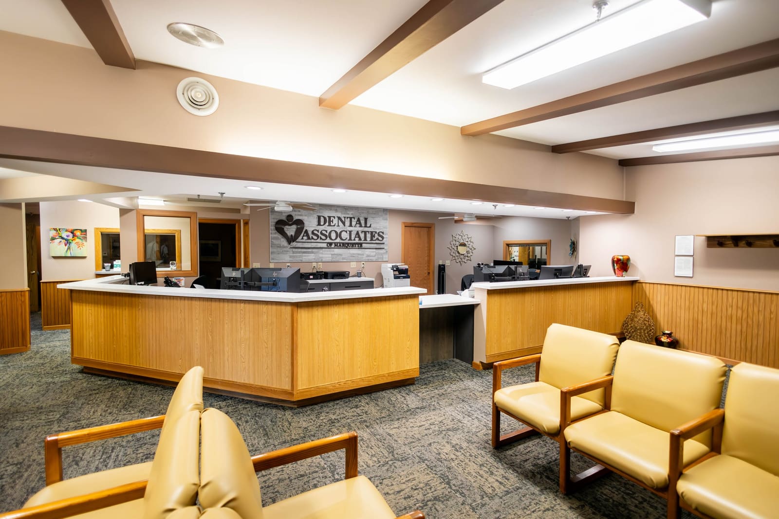 The front desk team in the newly remodeled Dental Associates of Marquette lobby